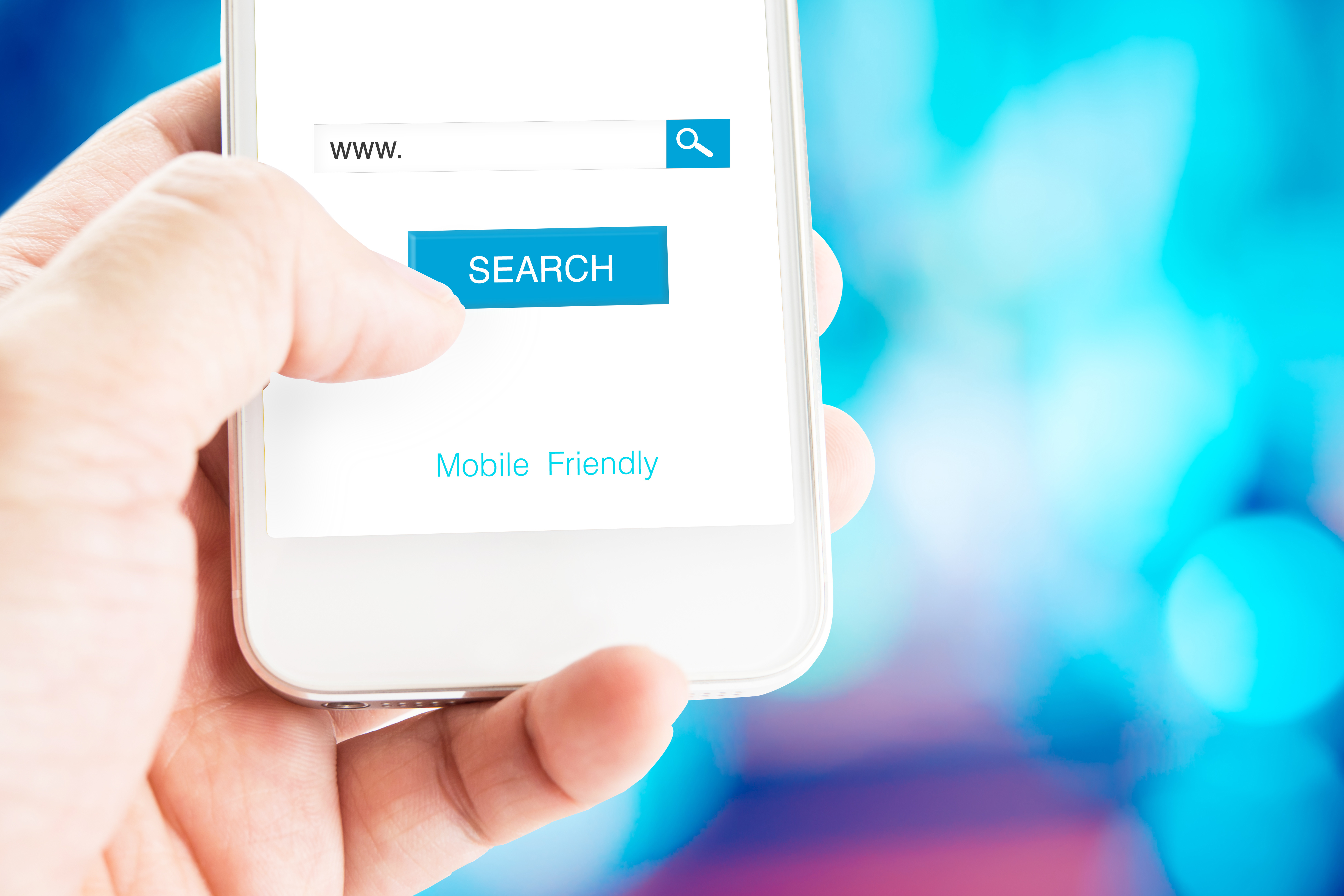 Hand holding mobile phone with search page on screen with mobile friendly feature at blurred blue background, Search engine business concept.